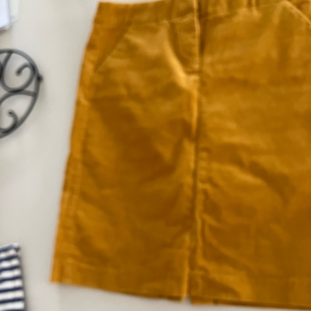 Adorable corduroy skirt, mustard orange/yellow, size 4. Never worn but no tags.